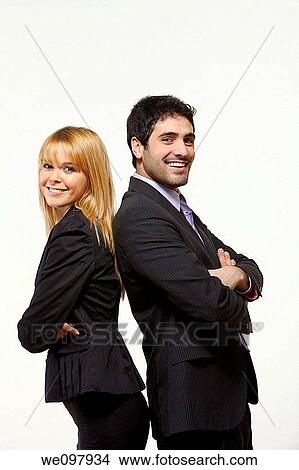 Picture - Good looking blonde business people standing on white background with crossed arms. Fotosearch