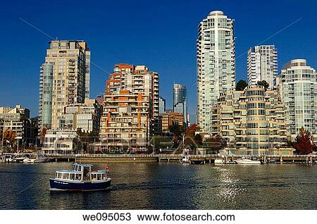 Granville Island water taxi crossing False Creek with Vancouver high rise condos View Large Photo Image Stock Image - Granville Island water taxi crossing False Creek with Vancouver high rise condos. Fotosearch