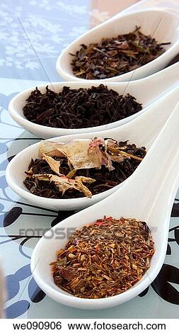 Stock Photograph - Green tea, black tea, jasmine tea, rooibos with flowers and fruit. Fotosearch