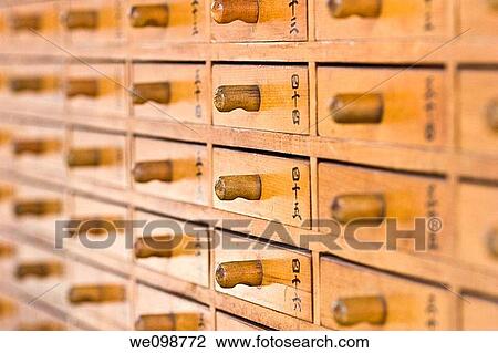 Grid of small wood drawers with Japanese numbers containing omikuji fortunes Sensoji buddhist temple, Asakusa district of Tokyo, Japan View Large Photo Image Stock Image - Grid of small wood drawers with Japanese numbers containing omikuji fortunes Sensoji buddhist temple, Asakusa district of Tokyo, Japan. Fotosearch