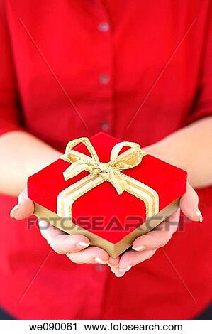 Stock Image - Hands holding gift. Fotosearch