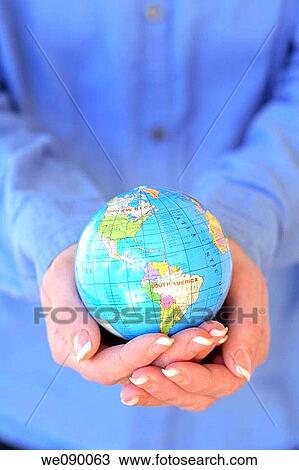 Hands holding globe View Large Photo Image Stock Image - Hands holding globe. Fotosearch