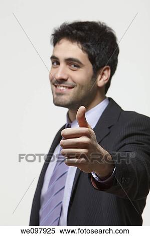 Happy business man giving thumbs up on white background View Large Photo Image Stock Photography - Happy business man giving thumbs up on white background. Fotosearch