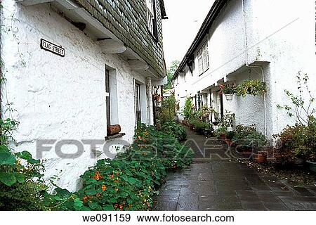 Hawshead, Lake District, Cumbria, UK Flag Street Picturesque narrow street with whitewashed houses in historic ancient market town of Hawkshead A settlement existed here from as early as the 10th Century - indeed the name Hawkshead derives from the Nor View Large Photo Image Stock Photo - Hawshead, Lake District, Cumbria, UK Flag Street Picturesque narrow street with whitewashed houses in historic ancient market town of Hawkshead A settlement existed here from as early as the 10th Century - indeed the name Hawkshead derives from the Nor. Fotosearch