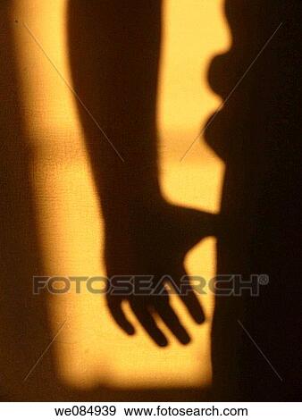 Human shadow on wall through an opening View Large Photo Image Stock Photo - Human shadow on wall through an opening. Fotosearch