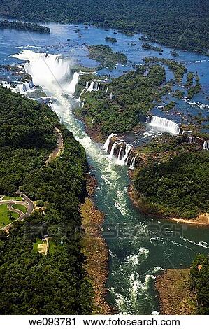 Stock Image - Iguassu Falls is the largest series of waterfalls on the planet, located in Brazil, Argentina, and Paraguay At some times during the year one can see as many as 275 separate waterfalls cascading along the edges of 2, 700 meters 1 6 miles cliffs Argentine. Fotosearch