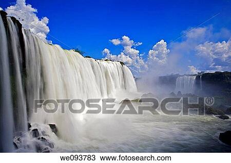Iguassu Falls is the largest series of waterfalls on the planet, located in Brazil, Argentina, and Paraguay At some times during the year one can see as many as 275 separate waterfalls cascading along the edges of 2, 700 meters 1 6 miles cliffs Argentine View Large Photo Image Stock Image - Iguassu Falls is the largest series of waterfalls on the planet, located in Brazil, Argentina, and Paraguay At some times during the year one can see as many as 275 separate waterfalls cascading along the edges of 2, 700 meters 1 6 miles cliffs Argentine. Fotosearch