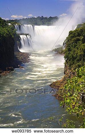 Iguassu Falls is the largest series of waterfalls on the planet, located in Brazil, Argentina, and Paraguay At some times during the year one can see as many as 275 separate waterfalls cascading along the edges of 2, 700 meters 1 6 miles cliffs Argentine View Large Photo Image Stock Photography - Iguassu Falls is the largest series of waterfalls on the planet, located in Brazil, Argentina, and Paraguay At some times during the year one can see as many as 275 separate waterfalls cascading along the edges of 2, 700 meters 1 6 miles cliffs Argentine. Fotosearch