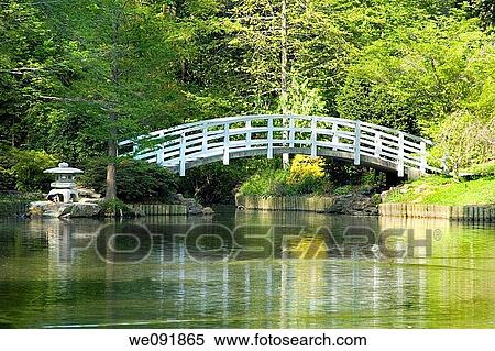 Stock Photography - Japanese Zen Garden with Arched moon bridge and pagoda. Fotosearch