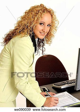 Joven administrativa tomando apuntes View Large Photo Image Stock Photo - Joven administrativa tomando apuntes. Fotosearch