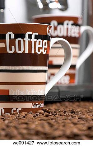 Kaffeetasse und Kaffeebohnen / Coffeebeans and a cup of coffee View Large Photo Image Stock Photo - Kaffeetasse und Kaffeebohnen / Coffeebeans and a cup of coffee. Fotosearch