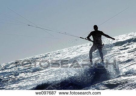 kite surfer surfing a wave in wild water View Large Photo Image Stock Photo - kite surfer surfing a wave in wild water. Fotosearch