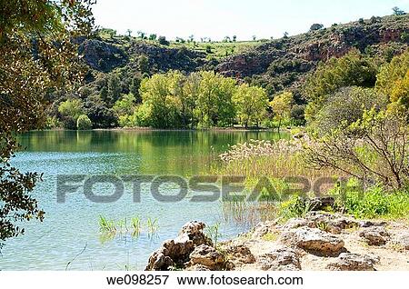 La Colgada lake. Lagunas de Ruidera Nature Reserve, Ciudad Real province, Castilla La Mancha, Spain. View Large Photo Image Stock Photo - La Colgada lake. Lagunas de Ruidera Nature Reserve, Ciudad Real province, Castilla La Mancha, Spain.. Fotosearch