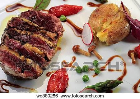 Lamb steak stuffed with Fois Gra and served with baked potatoes, mushrooms and asparagus View Large Photo Image Stock Photograph - Lamb steak stuffed with Fois Gra and served with baked potatoes, mushrooms and asparagus. Fotosearch