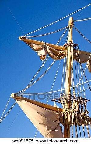 Late afternoon sunlight on a ship's mast with sails and ropes View Large Photo Image Stock Photography - Late afternoon sunlight on a ship's mast with sails and ropes. Fotosearch