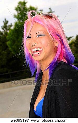 Laughing Young Flamboyant Asian Woman With Dyed Hair And Facial