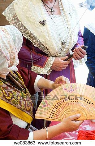 Stock Image - ? Les Mireilles? ladies in traditionnal Proven? al dress for Pentecost feast, Nimes. Gard, Languedoc-Roussillon, France. Fotosearch
