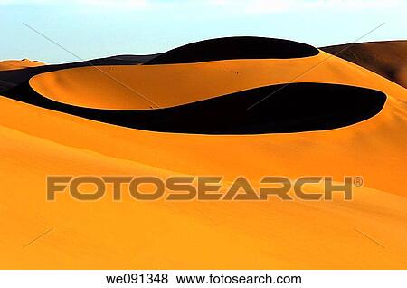 Light and shadows in the sand dunes of Erg Muzurq, Sahara desert, Libya View Large Photo Image Stock Photo - Light and shadows in the sand dunes of Erg Muzurq, Sahara desert, Libya. Fotosearch