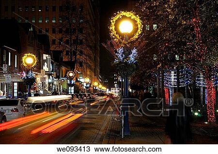 Light streaks of moving cars and Christmas lights on the streets of Yorkville Toronto at night View Large Photo Image Stock Image - Light streaks of moving cars and Christmas lights on the streets of Yorkville Toronto at night. Fotosearch