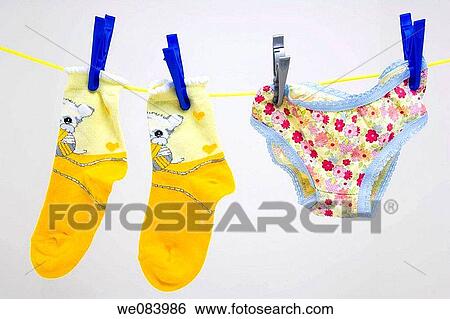 Little girl's colourful socks and pants on the washing line View Large Photo Image Stock Photograph - Little girl's colourful socks and pants on the washing line. Fotosearch
