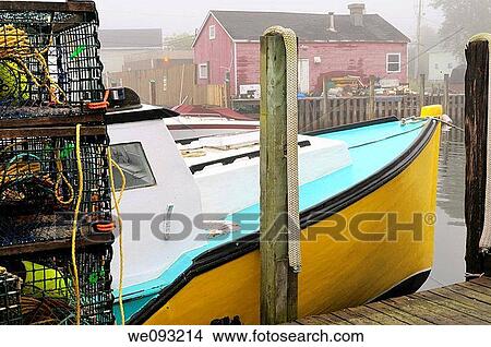 Lobster traps with yellow boat and red house in fog at Fishermans Cove Eastern Passage Halifax Nova Scotia View Large Photo Image Picture - Lobster traps with yellow boat and red house in fog at Fishermans Cove Eastern Passage Halifax Nova Scotia. Fotosearch