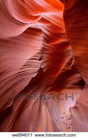 Lower Antelope Canyon located near Page Arizona on the Navajo reservation A slot canyon is a narrow canyon, formed by the wear of water rushing through rock View Large Photo Image Stock Image - Lower Antelope Canyon located near Page Arizona on the Navajo reservation A slot canyon is a narrow canyon, formed by the wear of water rushing through rock. Fotosearch