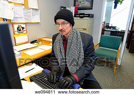 Man with hat gloves and scarf in an office while hacking into the computer system of an organization View Large Photo Image Stock Image - Man with hat gloves and scarf in an office while hacking into the computer system of an organization. Fotosearch