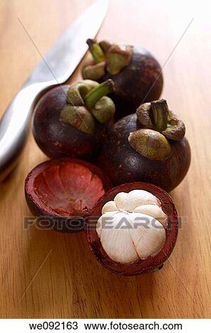 Mangosteen on chopping board View Large Photo Image Stock Image - Mangosteen on chopping board. Fotosearch