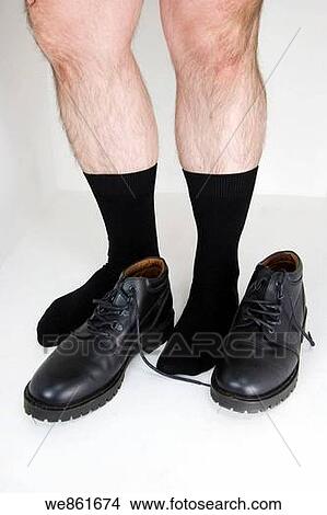 Man's legs and black shoes. View Large Photo Image Picture - Man's legs and black shoes.. Fotosearch