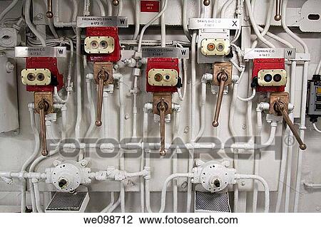 Many valves, levers, and pipes, part of the infrastructure of the Midway aircraft carrier in San Diego, California, USA View Large Photo Image Stock Image - Many valves, levers, and pipes, part of the infrastructure of the Midway aircraft carrier in San Diego, California, USA. Fotosearch
