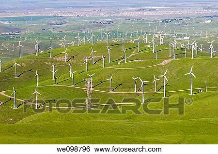 Many windmills in a large hilly field overlooking the town of Livermore, California View Large Photo Image Stock Photograph - Many windmills in a large hilly field overlooking the town of Livermore, California. Fotosearch