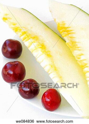 Melon with cherries View Large Photo Image Stock Photograph - Melon with cherries. Fotosearch