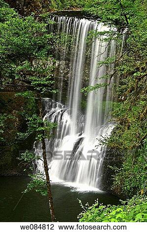 Middle North Falls drops 106 feet and has a passageway for people to walk behind it View Large Photo Image Stock Image - Middle North Falls drops 106 feet and has a passageway for people to walk behind it. Fotosearch