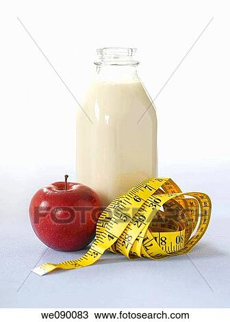 Milk, apple and tape measure View Large Photo Image Stock Image - Milk, apple and tape measure. Fotosearch