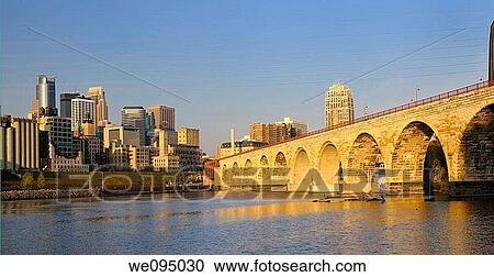 Minneapolis highrise tower skyline and the Stone Arch Bridge on the Mississippi at sunrise View Large Photo Image Stock Image - Minneapolis highrise tower skyline and the Stone Arch Bridge on the Mississippi at sunrise. Fotosearch