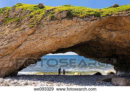 Mother and daughter holding hands on the beach at Arches Provincial Park Newfoundland Canada View Large Photo Image Stock Photo - Mother and daughter holding hands on the beach at Arches Provincial Park Newfoundland Canada. Fotosearch