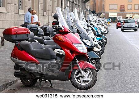 Stock Photography - Motor Scooters Parked at Curbside in Florence, Italy. Fotosearch