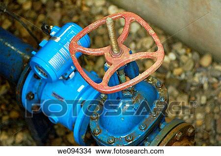 Picture - Motorized water valve remoted into a ground case. Fotosearch
