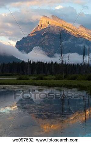 mount rundle in banff national park appearing out of mist and clouds View Large Photo Image Stock Image - mount rundle in banff national park appearing out of mist and clouds. Fotosearch