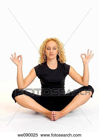 Stock Photography - Mujer joven en posici? n de meditaci? n. Fotosearch