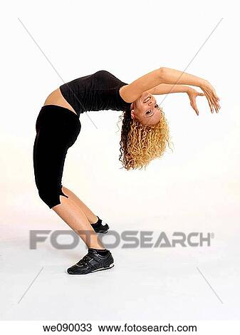 Mujer joven realizando deporte View Large Photo Image Stock Image - Mujer joven realizando deporte. Fotosearch