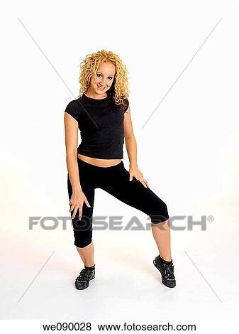 Mujer joven realizando movimientos de baile View Large Photo Image Stock Photo - Mujer joven realizando movimientos de baile. Fotosearch