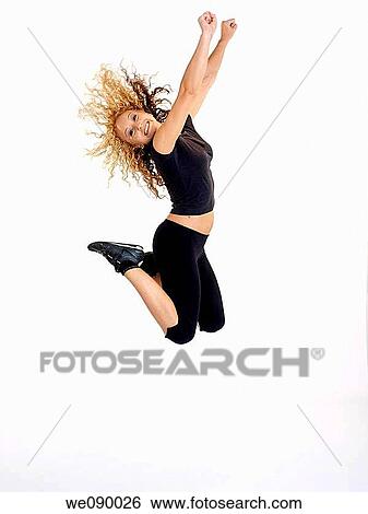 Mujer joven saltando View Large Photo Image Stock Photograph - Mujer joven saltando. Fotosearch