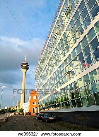 Stock Photo - Neuer Zolholf buildings offices by the architect Frank Gehry, Medienhafen and Rhine TV tower Dusseldorf, Germany, Europe. Fotosearch