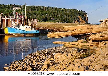 Old dock and Owls Head cliff at sunset on the Bay of Fundy Alma New Brunswick View Large Photo Image Stock Photo - Old dock and Owls Head cliff at sunset on the Bay of Fundy Alma New Brunswick. Fotosearch