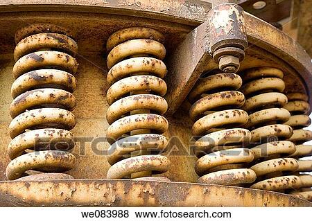 Stock Photo - Old rusted springs of shock absorber. Fotosearch