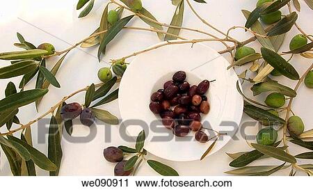 Stock Image - Olives and olive branch. Fotosearch