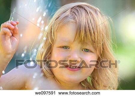 outdoor portrait of a beatiful boy with long blond hair View Large Photo Image Stock Image - outdoor portrait of a beatiful boy with long blond hair. Fotosearch