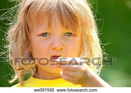 outdoor portrait of a beatiful boy with long blond hair View Large Photo Image Stock Image - outdoor portrait of a beatiful boy with long blond hair. Fotosearch