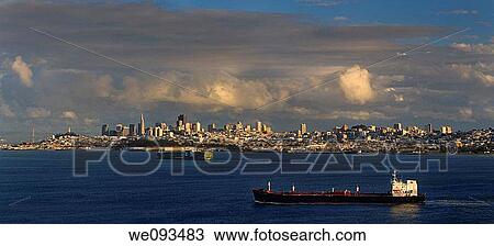 Panorama of downtown San Francisco at sunset after a storm with tanker and container ship on the Bay View Large Photo Image Stock Image - Panorama of downtown San Francisco at sunset after a storm with tanker and container ship on the Bay. Fotosearch